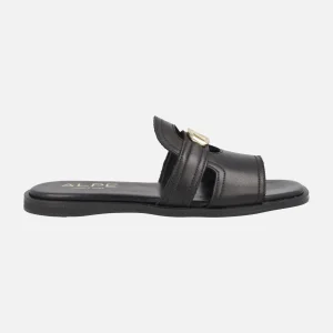 Sandalias planas estilo pala Sheila en piel negra con adorno oro