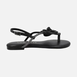 Sandalias planas negras de piel con adorno de flor y strass