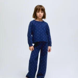 Pantalón de niña de punto azul marino con lunares rosas