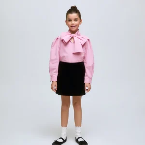 Falda corta de niña de pana en color negro canalé.