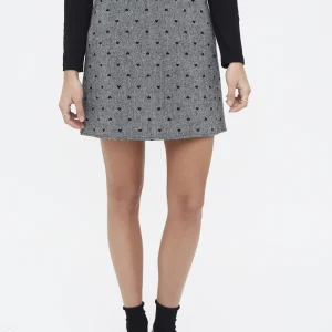 Falda tweed con estampado de corazones negro