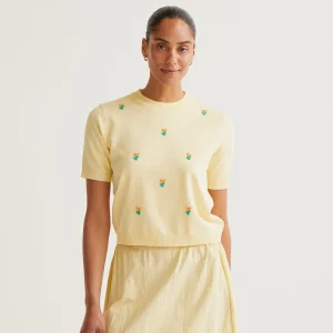 Top punto suave amarillo con flores