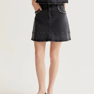 Falda vaquero negro con detalle de volantes